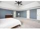 A view of the large main bedroom with high ceilings, neutral walls, and plush carpeting at 2689 Spring Rock Ne Ct, Roswell, GA 30075