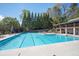 Community pool with a lifeguard stand, lounge chairs and covered pavilion at 2689 Spring Rock Ne Ct, Roswell, GA 30075