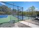 Community tennis courts with blue and green surfacing, surrounded by chain-link fencing at 2689 Spring Rock Ne Ct, Roswell, GA 30075