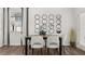 Dining room features a table with six chairs and modern decorative mirrors on the wall at 2810 Georgia Aster Nw Way # 6, Atlanta, GA 30318