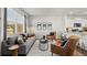 Bright living room with gray sofa, two chairs, and natural light at 2810 Georgia Aster Nw Way # 6, Atlanta, GA 30318