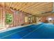 Unfinished basement, framed, with blue matting, and exposed ceiling beams at 3405 Camellia Ln, Suwanee, GA 30024