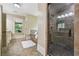 Luxurious bathroom showcasing a glass shower, soaking tub, and tiled accents at 3405 Camellia Ln, Suwanee, GA 30024
