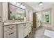 Bright bathroom featuring double vanities, granite countertops, and tile flooring at 3405 Camellia Ln, Suwanee, GA 30024