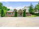 Charming community clubhouse featuring a brick facade, well-maintained landscaping, and a welcoming entrance at 3405 Camellia Ln, Suwanee, GA 30024