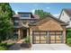 Charming brick home with a two-car garage, manicured landscaping, and inviting entrance at 3405 Camellia Ln, Suwanee, GA 30024