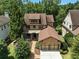 Beautiful brick home with mature trees features a two car garage and manicured landscaping at 3405 Camellia Ln, Suwanee, GA 30024