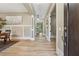 Inviting foyer with hardwood floors, elegant wainscoting, and a view through to the living spaces at 3405 Camellia Ln, Suwanee, GA 30024