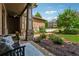 Inviting covered front porch with brickwork, stone columns, and landscaped front yard at 3405 Camellia Ln, Suwanee, GA 30024