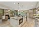 Beautiful kitchen with granite island, stainless appliances and view to living area at 3405 Camellia Ln, Suwanee, GA 30024