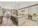 Spacious kitchen with center island, stainless appliances and open layout to dining at 3405 Camellia Ln, Suwanee, GA 30024