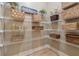 Walk-in pantry with ample shelving for organized storage at 3405 Camellia Ln, Suwanee, GA 30024