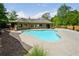 Inviting community pool with ample lounging space and well-kept surrounding area at 3405 Camellia Ln, Suwanee, GA 30024