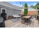Relaxing outdoor deck with comfortable seating, dining area, and sail shade for entertaining at 170 Shelli Ln, Roswell, GA 30075