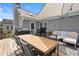 Spacious back deck offers outdoor dining and seating area with sail shade and grill at 170 Shelli Ln, Roswell, GA 30075