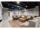 Finished basement with leather couches, projector, and built in shelving at 170 Shelli Ln, Roswell, GA 30075