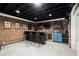 Finished basement boasts a stylish bar area with brick accents and modern fixtures at 170 Shelli Ln, Roswell, GA 30075