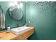 Stylish powder room boasts modern fixtures and a unique sink at 170 Shelli Ln, Roswell, GA 30075