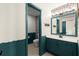 Bathroom with turquoise wainscoting and stylish mirror at 170 Shelli Ln, Roswell, GA 30075