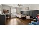 Comfortable bedroom with hardwood floors, neutral colors, and a ceiling fan at 170 Shelli Ln, Roswell, GA 30075
