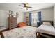 Bedroom features an area rug, hardwood floors, a large window and neutral colored walls at 170 Shelli Ln, Roswell, GA 30075