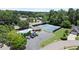 Aerial view featuring a pool, tennis courts, parking, and lovely manicured community grounds at 170 Shelli Ln, Roswell, GA 30075