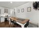 Dining area featuring hardwood floors and breakfast bar at 170 Shelli Ln, Roswell, GA 30075