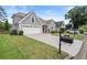 Charming two-story home featuring a manicured lawn, a two-car garage, and attractive architectural details at 170 Shelli Ln, Roswell, GA 30075