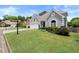 Well-maintained home with manicured front lawn, mature landscaping, and inviting curb appeal on a sunny day at 170 Shelli Ln, Roswell, GA 30075