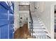 Welcoming foyer with hardwood floors, staircase with iron railings, and neutral wall paint at 170 Shelli Ln, Roswell, GA 30075