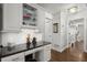 Kitchenette featuring built-in cabinets and black granite countertop at 170 Shelli Ln, Roswell, GA 30075