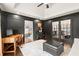 Chic living room featuring dark walls, barn door, and views into the entryway at 170 Shelli Ln, Roswell, GA 30075