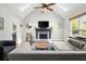 Living room featuring vaulted ceilings, fireplace, and ample natural light at 170 Shelli Ln, Roswell, GA 30075