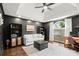 Comfortable living room with dark accent walls, tray ceiling, and a window view of the yard at 170 Shelli Ln, Roswell, GA 30075