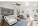Cozy living room featuring hardwood floors, a ceiling fan, and open view to kitchen at 170 Shelli Ln, Roswell, GA 30075