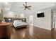 Spacious main bedroom featuring hardwood floors, tray ceiling, and designer touches at 170 Shelli Ln, Roswell, GA 30075