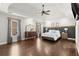 Tranquil main bedroom with tray ceiling, hardwood floors, and ample natural light at 170 Shelli Ln, Roswell, GA 30075