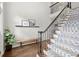 Foyer with decorative staircase, bench, and hardwood floors at 170 Shelli Ln, Roswell, GA 30075