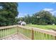 View of the home from the backyard, showing the extensive yard, play area and lush trees at 350 Dailey Mill Rd, Mcdonough, GA 30253