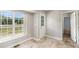 Bright dining area with large windows overlooking the deck and backyard at 350 Dailey Mill Rd, Mcdonough, GA 30253