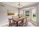 Inviting dining room bathed in natural light from expansive windows, ideal for enjoying meals with Gathering at 350 Dailey Mill Rd, Mcdonough, GA 30253
