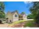 Well-maintained one-story home with a garage and driveway, nestled amidst lush greenery at 350 Dailey Mill Rd, Mcdonough, GA 30253