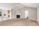 Open-concept living room featuring a fireplace and seamlessly connects to other living spaces, perfect for Gathering gatherings at 350 Dailey Mill Rd, Mcdonough, GA 30253