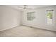 Carpeted bedroom offering natural light and a ceiling fan at 4098 Charlotte Se Ct, Smyrna, GA 30082