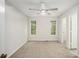 Neutral bedroom with carpet, ceiling fan, and natural light from two windows at 4098 Charlotte Se Ct, Smyrna, GA 30082
