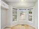 Bright breakfast nook features tile flooring, bay windows overlooking the front yard at 4098 Charlotte Se Ct, Smyrna, GA 30082