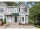 Charming townhome featuring a gray exterior, covered entry, and well-maintained landscaping at 4098 Charlotte Se Ct, Smyrna, GA 30082
