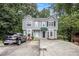 Inviting townhome with a driveway, lush trees, and charming curb appeal in a great neighborhood at 4098 Charlotte Se Ct, Smyrna, GA 30082