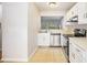 Kitchen with stainless steel appliances, tile floors, and a pass-through to the living area at 4098 Charlotte Se Ct, Smyrna, GA 30082