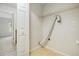 The utility room features built-in shelving and connections for a dryer, maximizing space and convenience at 4098 Charlotte Se Ct, Smyrna, GA 30082
